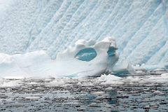 11C Small Iceberg With A Window Below A Large Iceberg From Zodiac In Paradise Harbour On Quark Expeditions Antarctica Cruise.jpg
